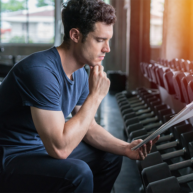 man studying in gym